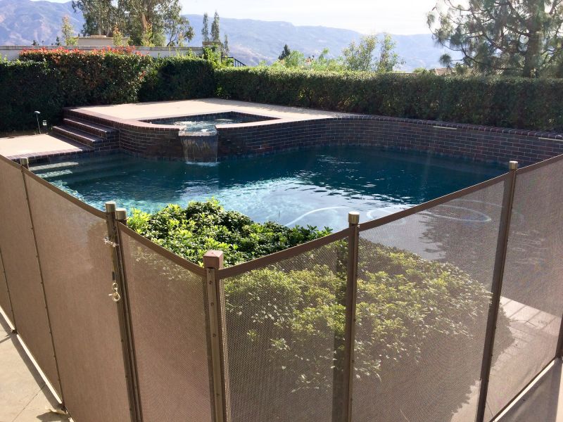 Pool Enclosed by Mesh Fence